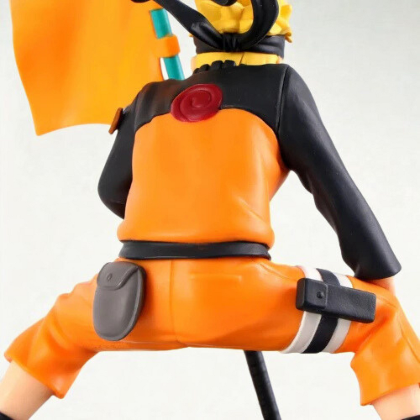 Naruto Uzumaki action figure holding Narutop 99 flag in dynamic pose – 15 cm collectible from Naruto Shippuden