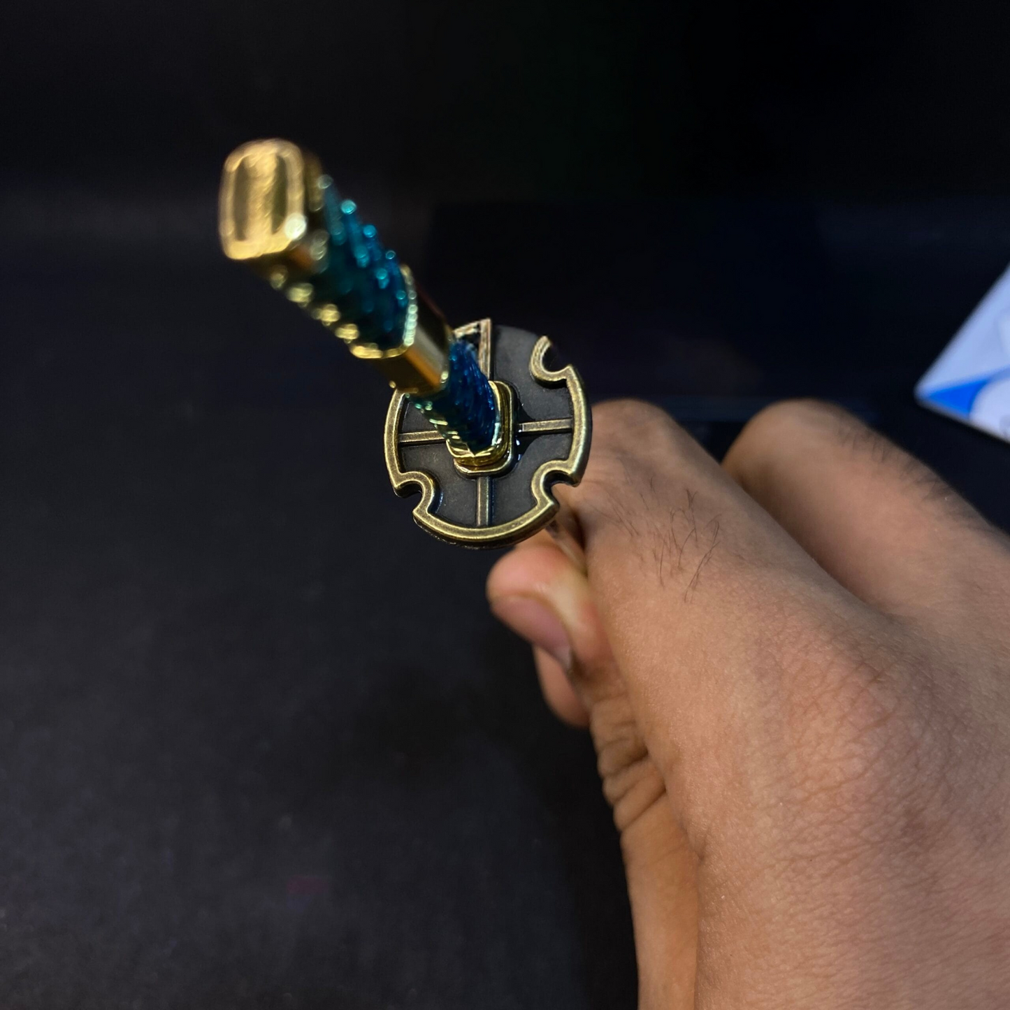 Miniature Sandai Kitetsu katana keyring from One Piece with red sheath and turquoise handle