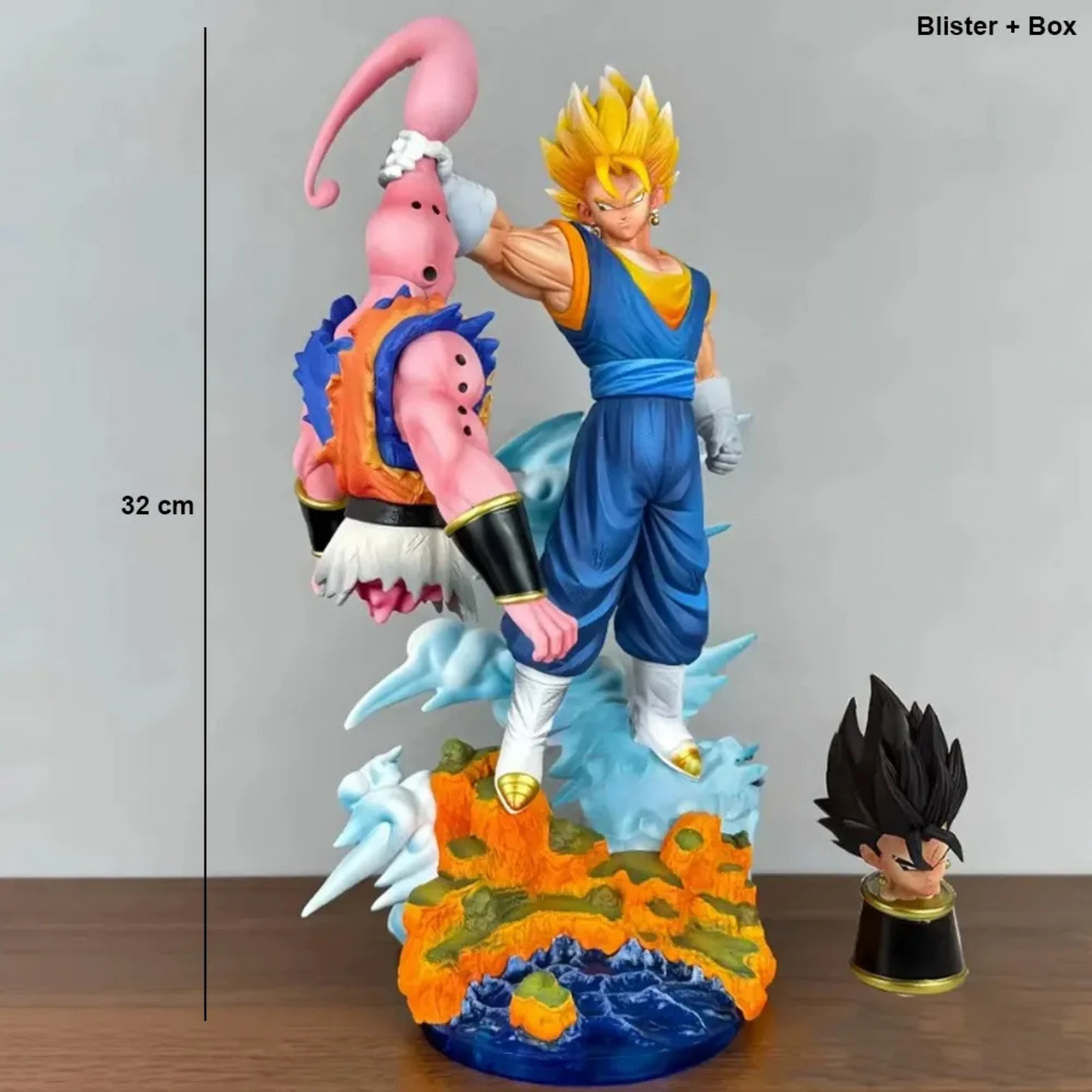 Dragon Ball Z action figure showing Super Saiyan Vegita lifting Majin Buu in battle pose with detailed rocky base and energy effects