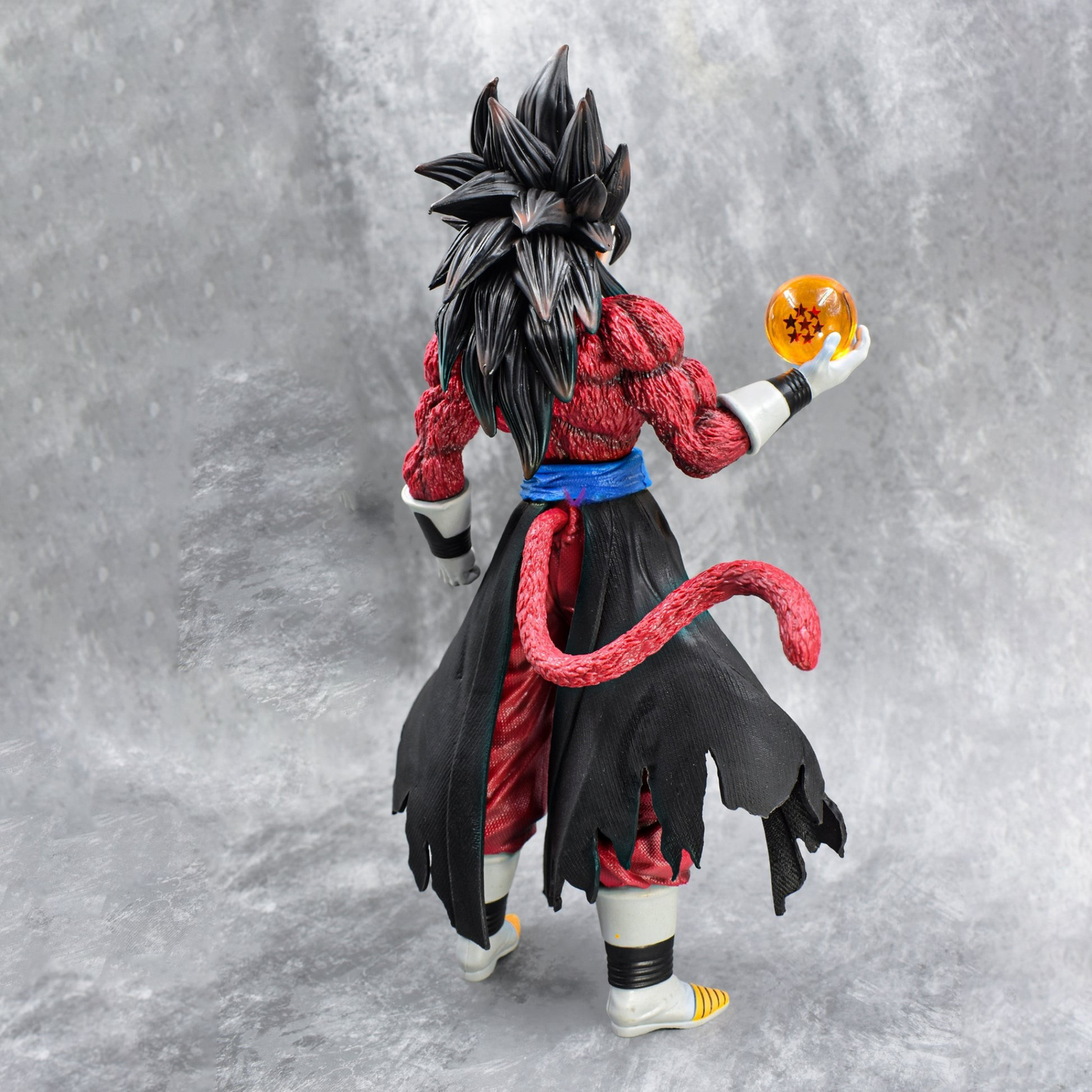 Super Saiyan 4 Goku collectible figure holding Dragon Ball