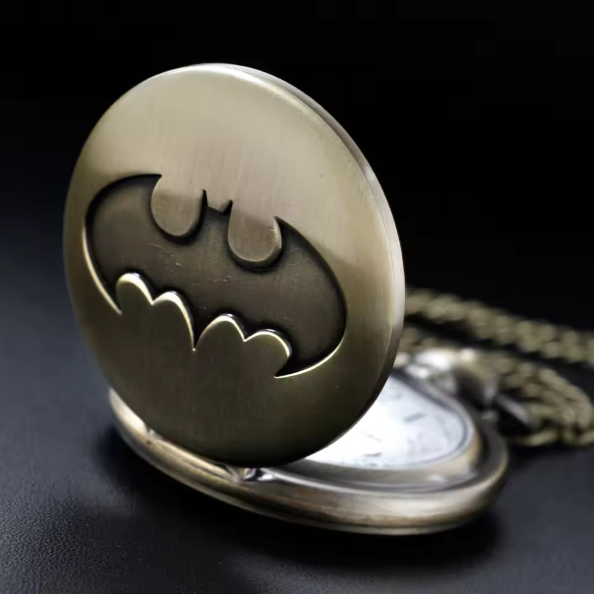 Vintage-style Batman metal pocket watch with keychain attachment featuring the iconic bat symbol