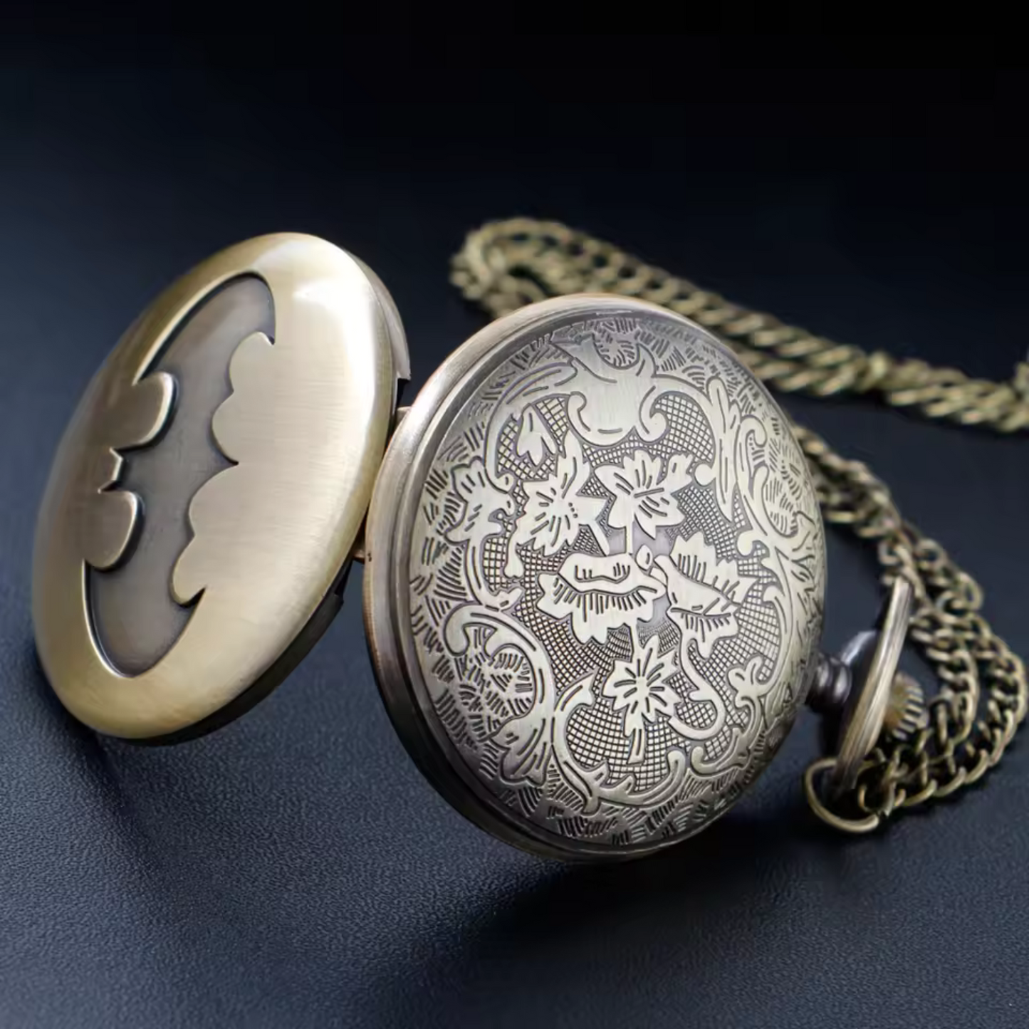 Vintage-style Batman metal pocket watch with keychain attachment featuring the iconic bat symbol