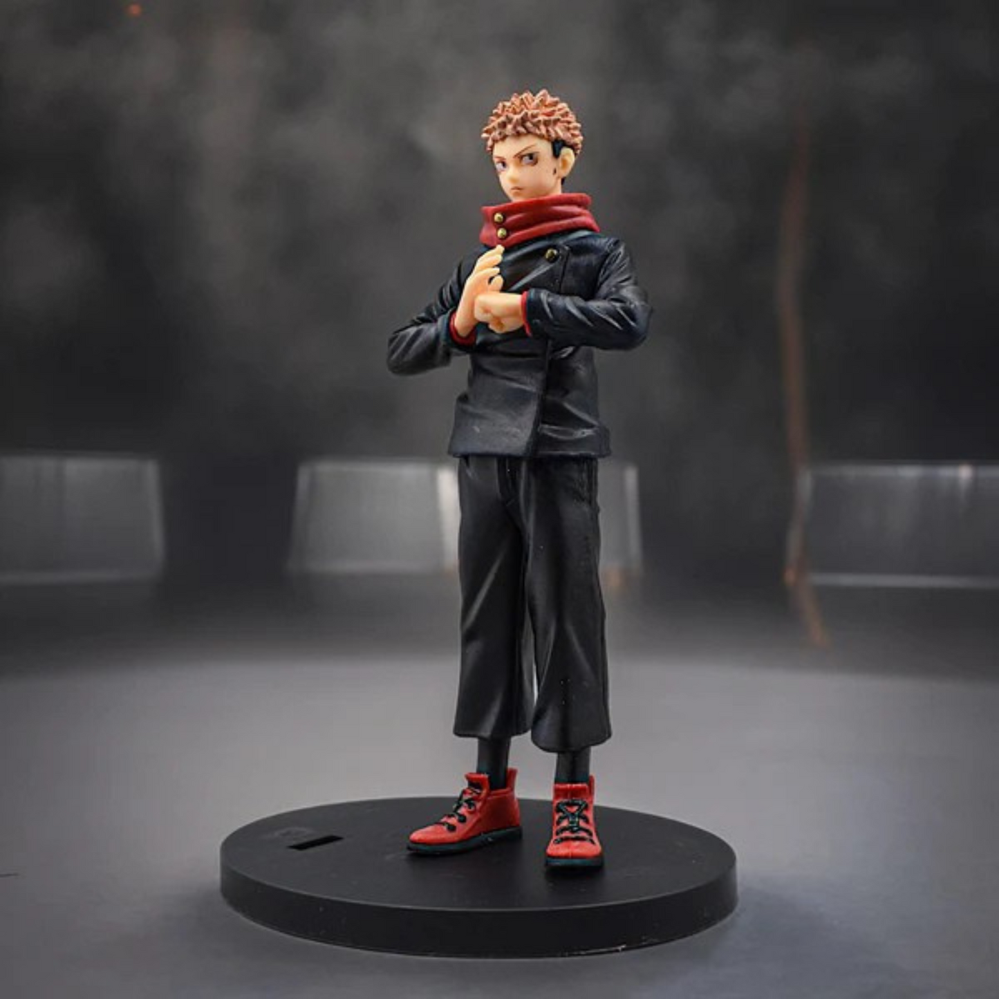 Jujutsu Kaisen Itadori Yuji action figure in school uniform with red hoodie, standing on a display base against a red-dark background