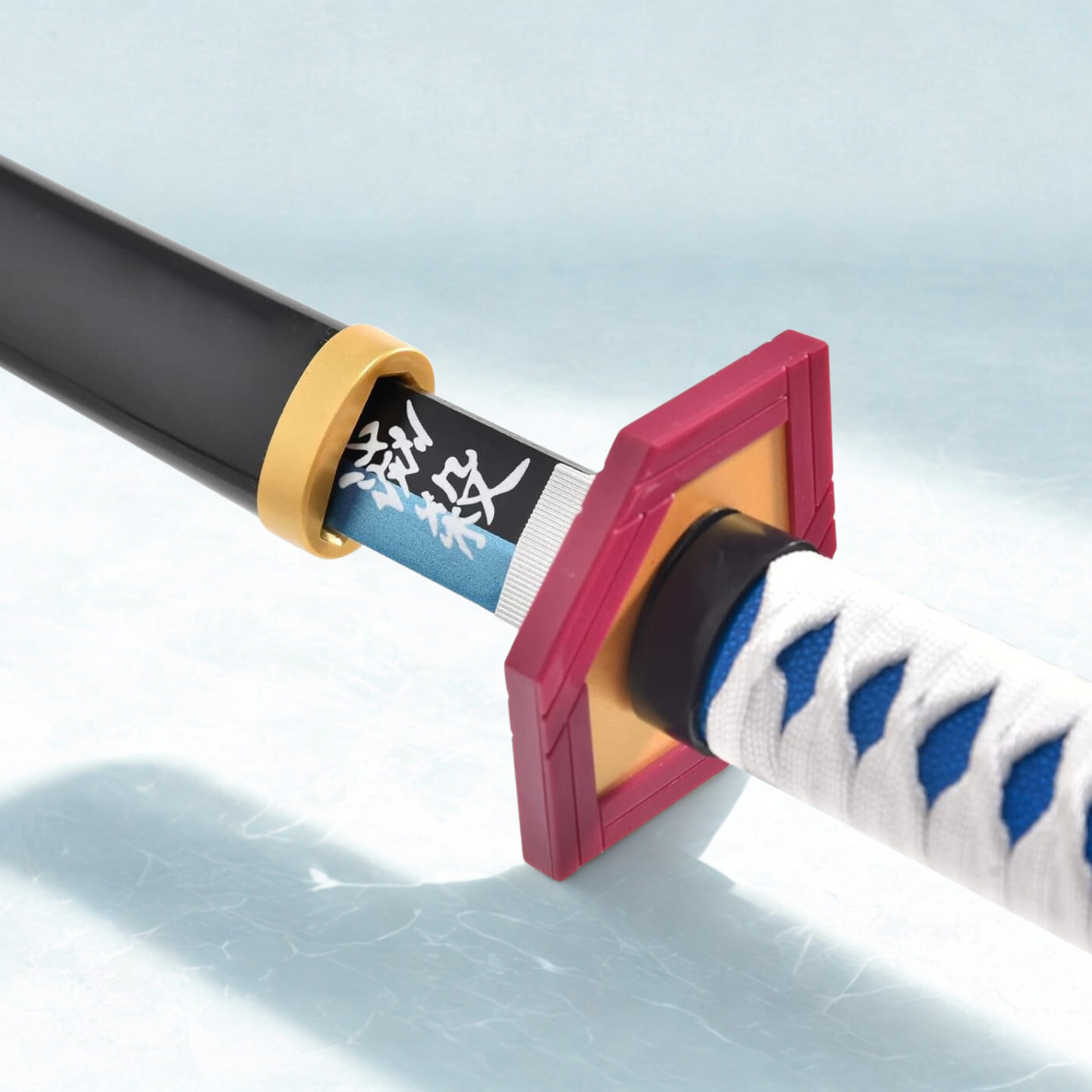 Giyu Tomioka wooden katana replica from Demon Slayer with blue-edged blade, white and blue handle, and black sheath on display stand