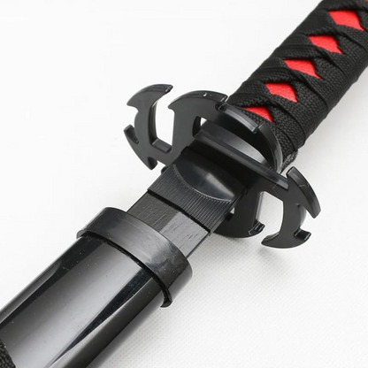 Black and red Ichigo Kurosaki wooden katana from Bleach anime, with jagged blade and decorative guard