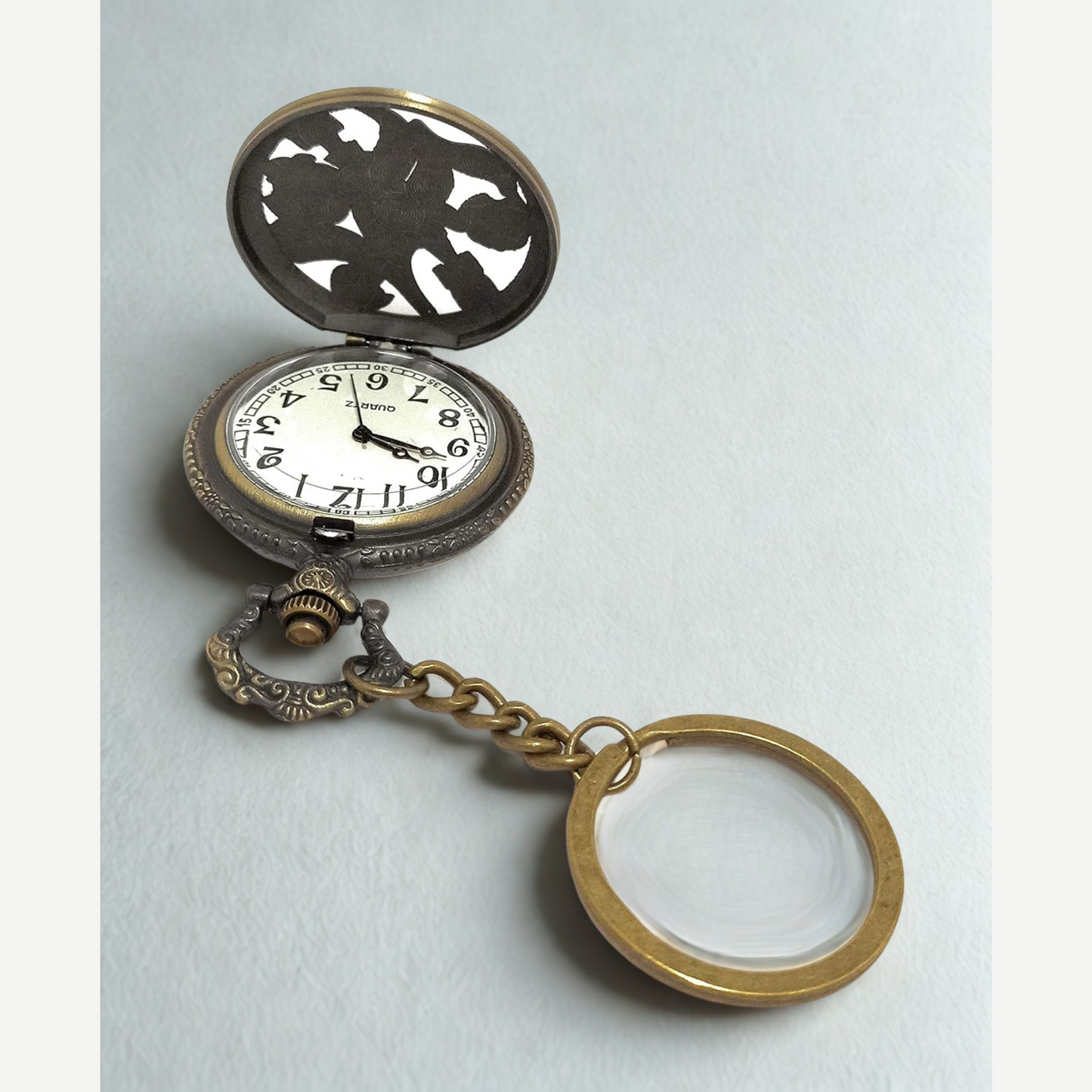 Close-up of engraved Death Note pocket watch with bold numerals and sleek finish