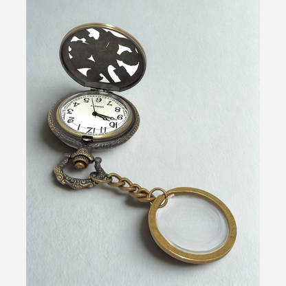 Close-up of engraved Death Note pocket watch with bold numerals and sleek finish