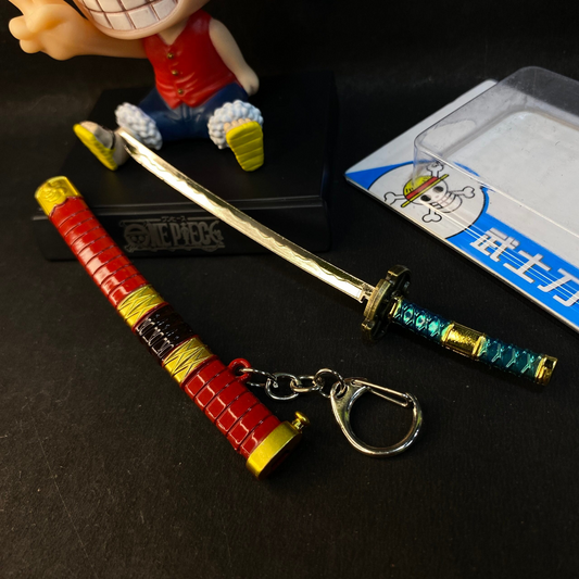 Miniature Sandai Kitetsu katana keyring from One Piece with red sheath and turquoise handle