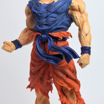 Dragon Ball Z: Legendary Super Saiyan Goku Action Figure - torso close-up with torn blue vest, blue waist sash and wristbands